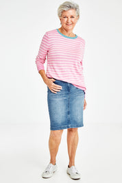 Model Elise wearing size 10 of the Miracle Denim Straight Skirt in colour Denim (Blue), from the front, showing the whole outfit
