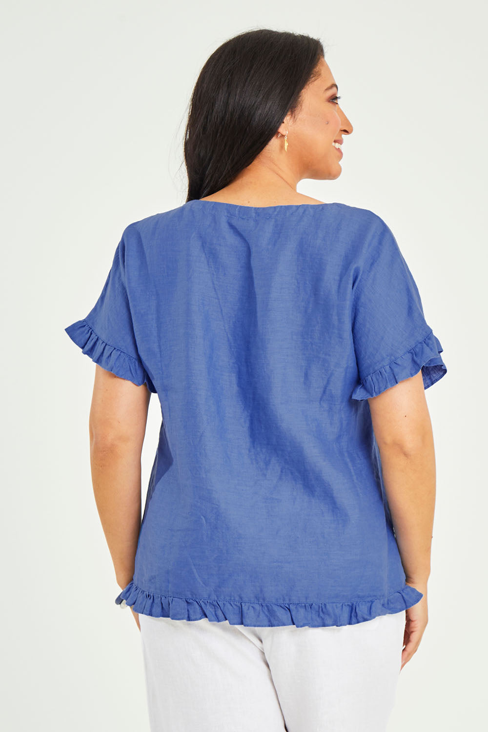 Model Terri-Leigh wearing size 14 of the Alex Ruffle Linen Top in colour Cobalt (Blue), from the back