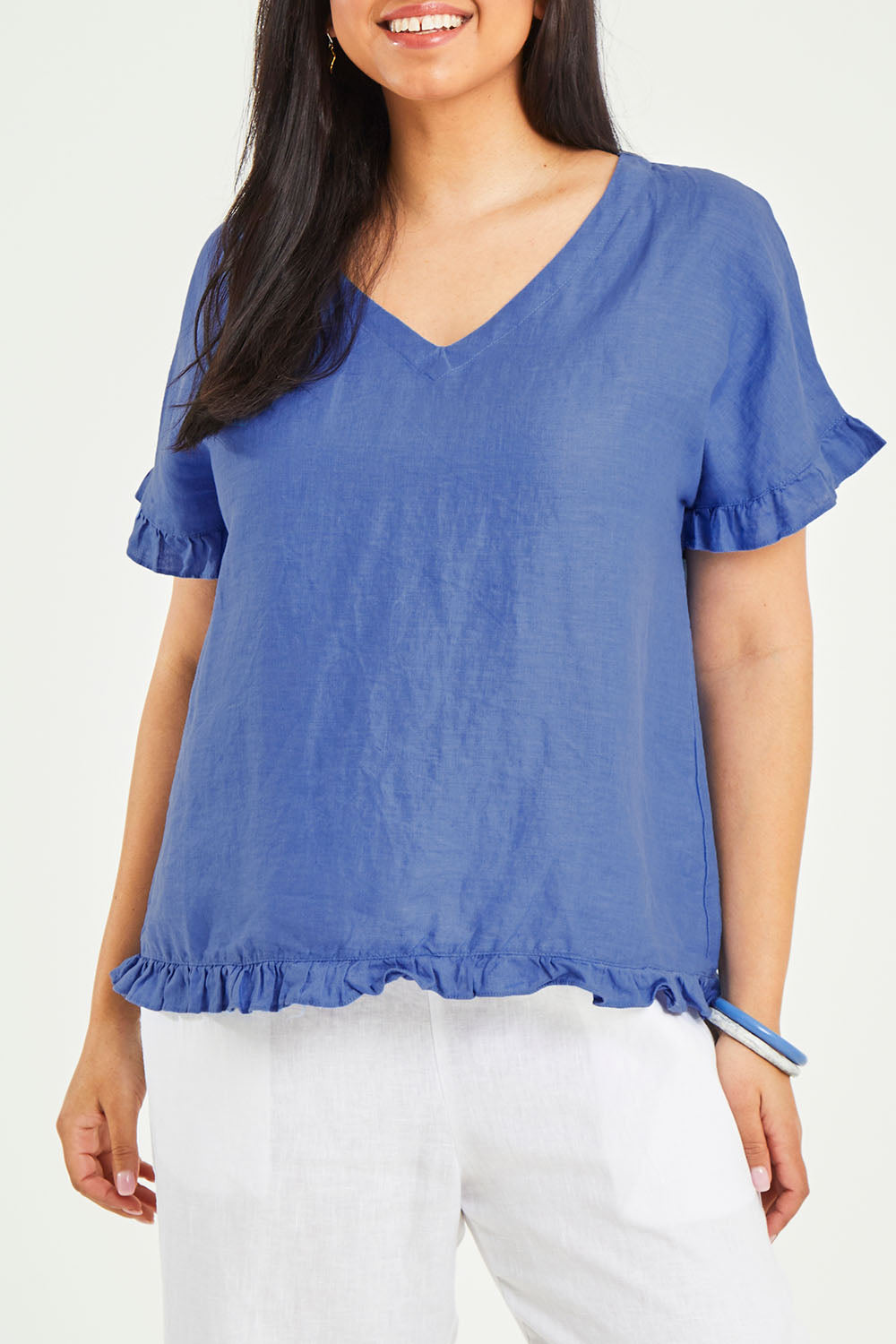 Model Terri-Leigh wearing size 14 of the Alex Ruffle Linen Top in colour Cobalt (Blue), from the front, cropped image