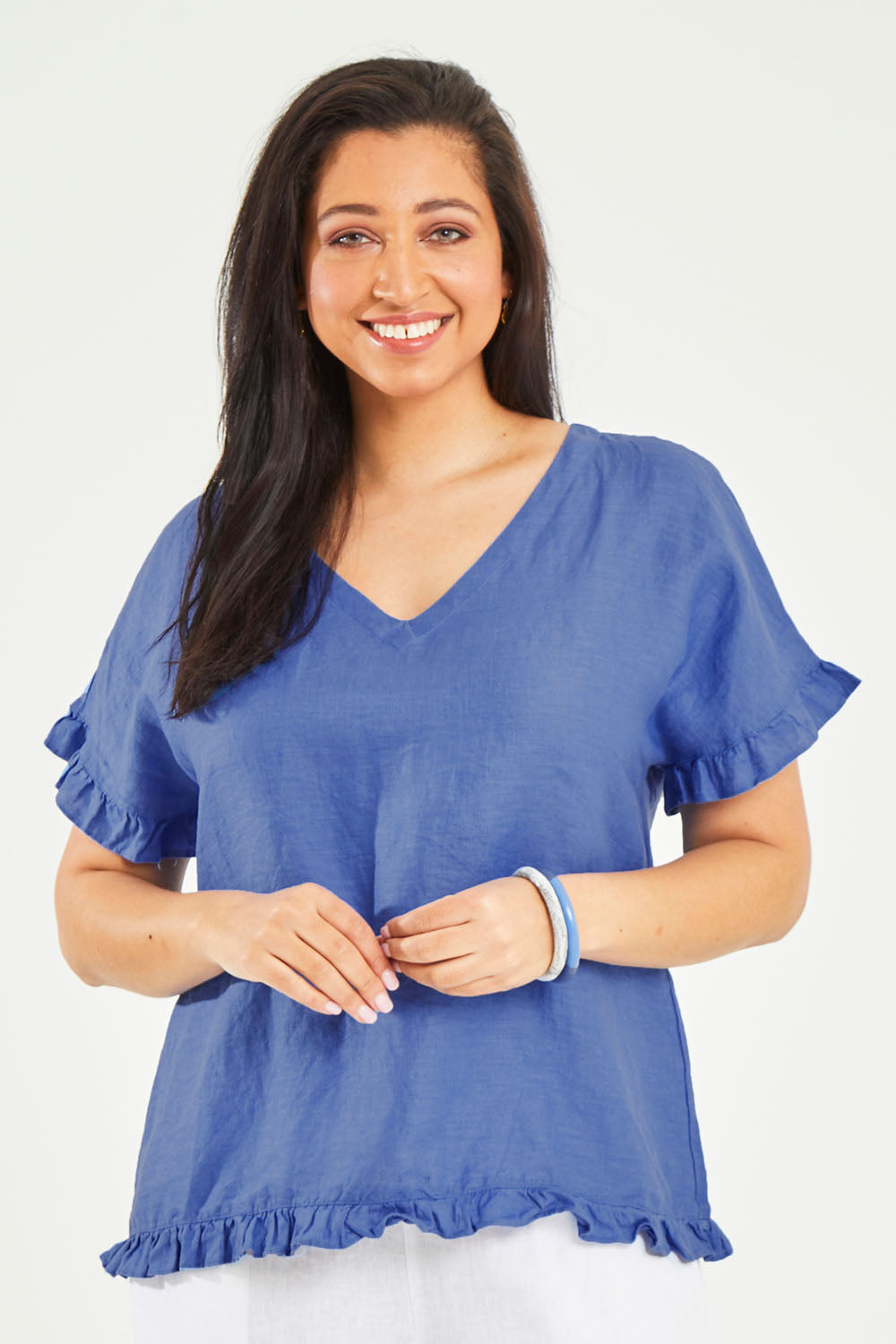 Model Terri-Leigh wearing size 14 of the Alex Ruffle Linen Top in colour Cobalt (Blue), from the front, cropped image