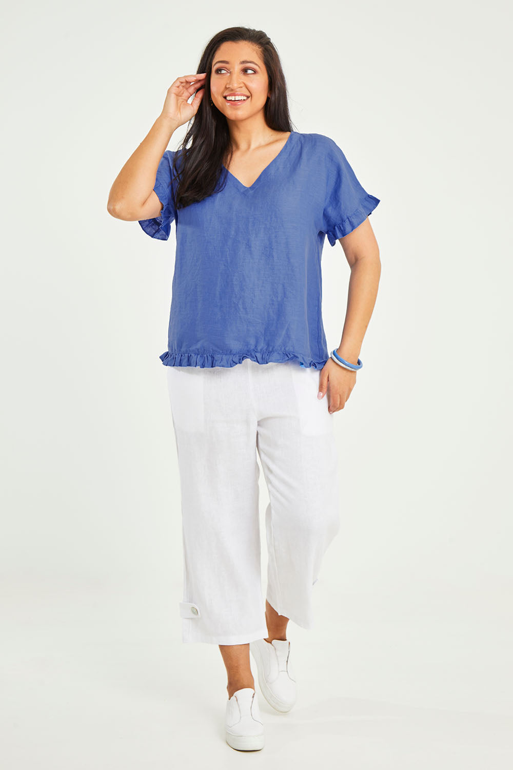 Model Terri-Leigh wearing size 14 of the Alex Ruffle Linen Top in colour Cobalt (Blue), from the front, showing the whole outfit