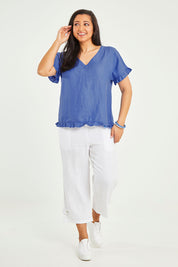 Model Terri-Leigh wearing size 14 of the Alex Ruffle Linen Top in colour Cobalt (Blue), from the front, showing the whole outfit