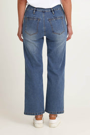 Model Riina wearing size 10 of the Hudson Wide Leg Jean in colour Denim (Blue), from the back