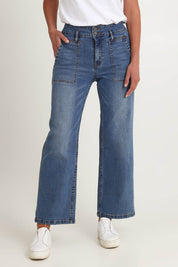 Model Riina wearing size 10 of the Hudson Wide Leg Jean in colour Denim (Blue), from the front, cropped image