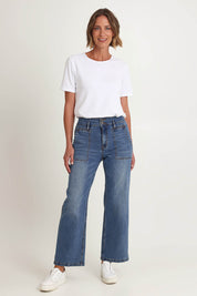 Model Riina wearing size 10 of the Hudson Wide Leg Jean in colour Denim (Blue), from the front, showing the whole outfit