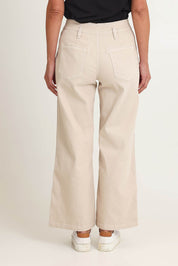 Model Riina wearing size 10 of the Hudson Wide Leg Jean in colour Natural, from the back
