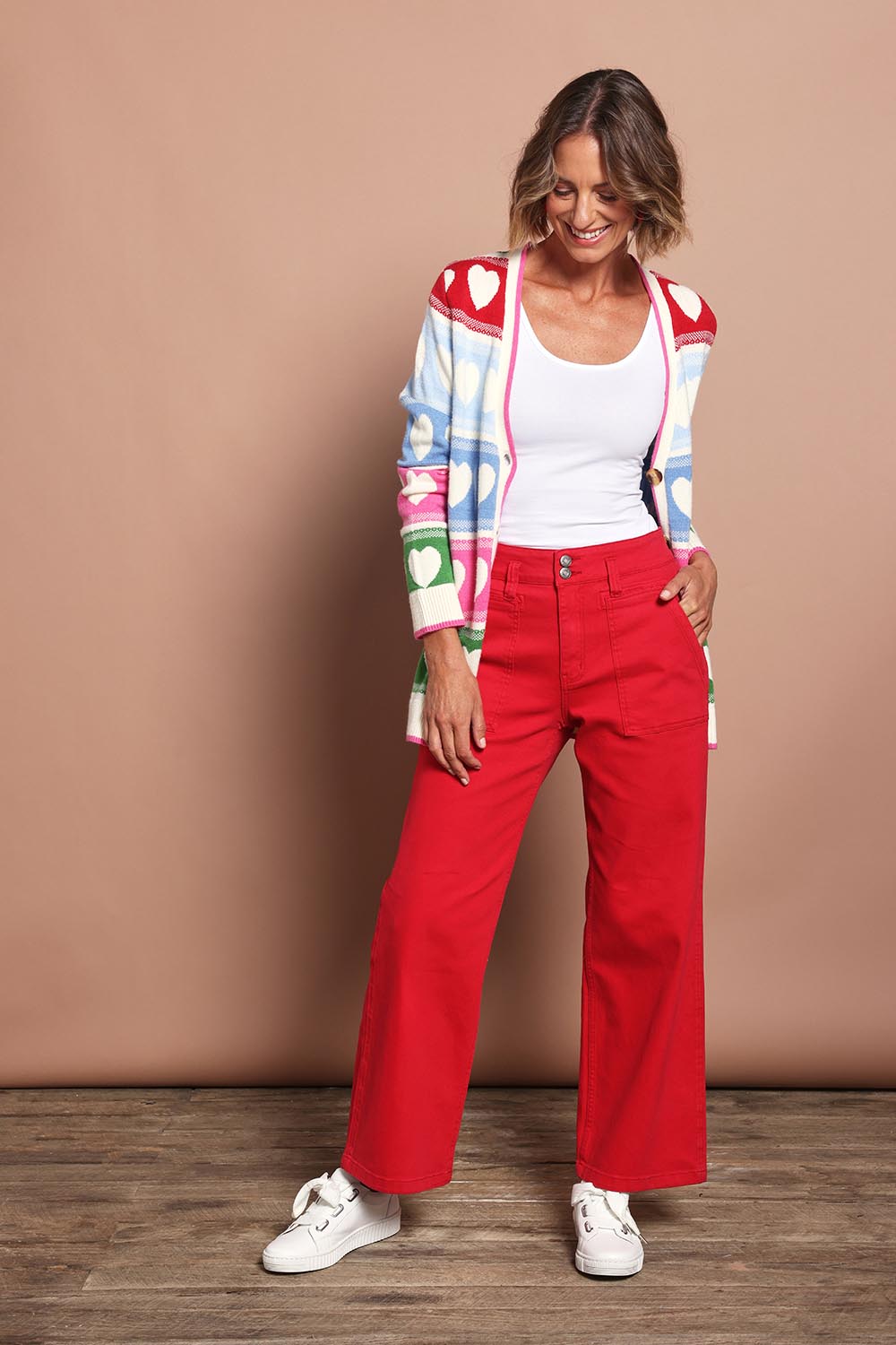 Model Riina wearing size 10 of the Hudson Wide Leg Jean in colour Red (Red), from the front, showing the whole outfit