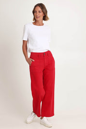 Model Riina wearing size 10 of the Hudson Wide Leg Jean in colour Red (Red), from the front, showing the whole outfit