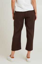 Model Grace wearing size 10 of the Classic Wide Leg Linen Pant in colour Koko, from the back
