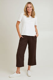 Model Grace wearing size 10 of the Classic Wide Leg Linen Pant in colour Koko, from the front, showing the whole outfit