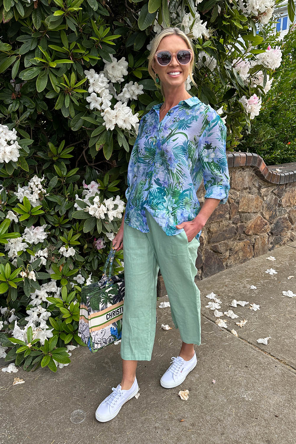A model wearing the Classic Wide Leg Linen Pant in colour Mint (Green), from the front, showing the whole outfit