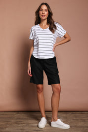 Model Madeline wearing size 10 of the Jersey Waist Linen Short in colour Black (Black), from the front, showing the whole outfit