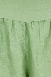 Product shot of the Jersey Waist Linen Short - Fern in colour Fern, showing detail