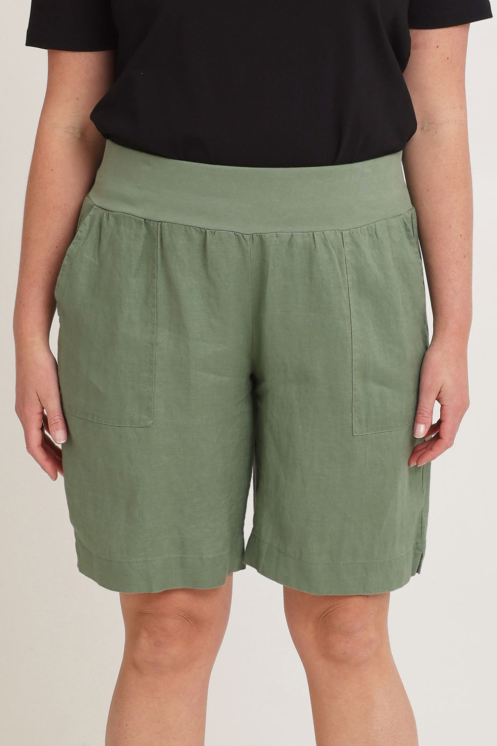 Model Chanel wearing size 16 of the Jersey Waist Linen Short in colour Khaki (Green), from the front, cropped image