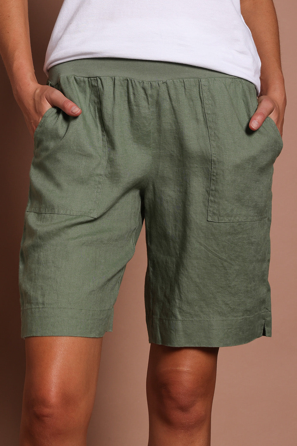 Model Madeline wearing size 10 of the Jersey Waist Linen Short in colour Khaki (Green), from the front, cropped image