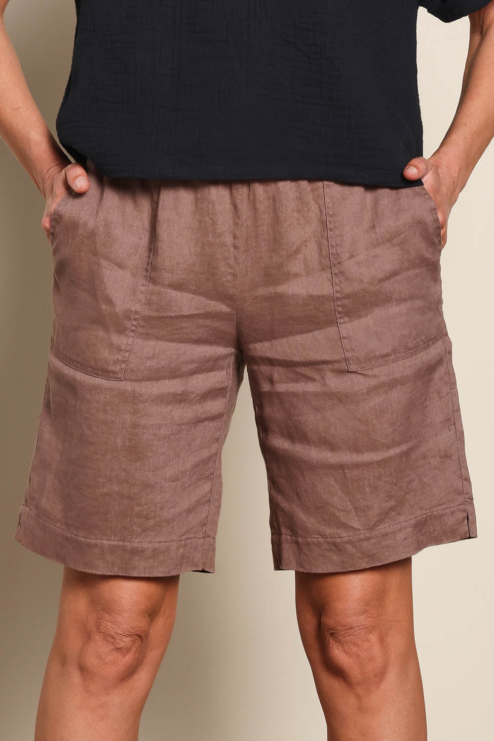 Model Riinar wearing size 10 of the Jersey Waist Linen Short - Mocha in colour Mocha, in a cropped view