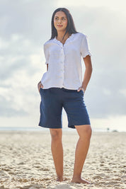 Model Eshan wearing size 10 of the Jersey Waist Linen Short - Navy in colour Navy, from the front
