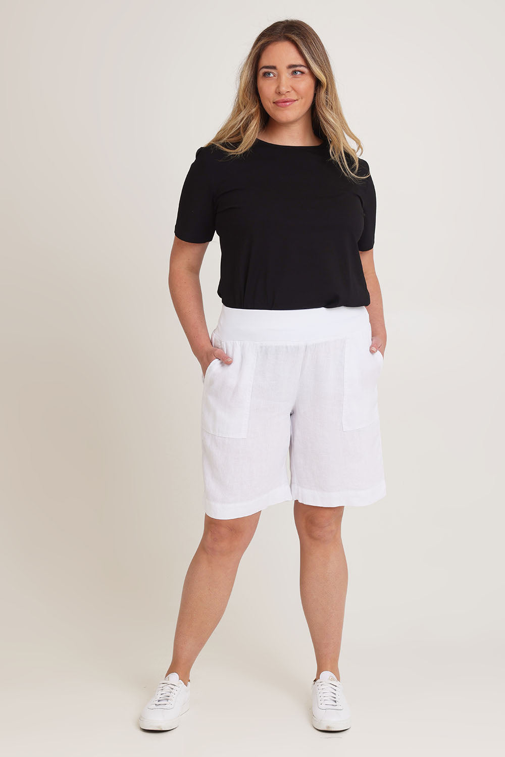 Model Chanel wearing size 16 of the Jersey Waist Linen Short in colour White (White), from the front, showing the whole outfit