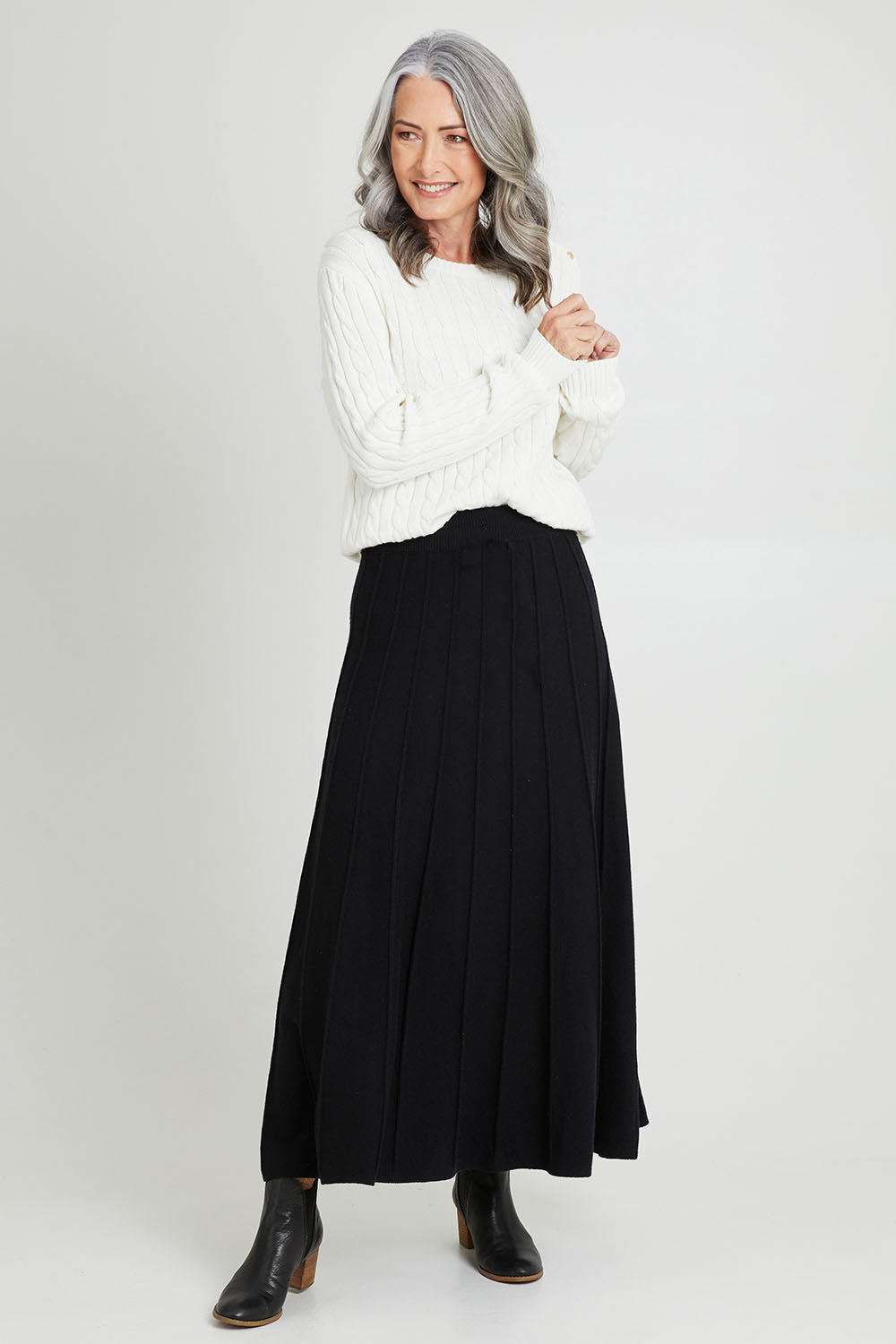 Model Luisa wearing size S of the Kate Knit Long Skirt in colour Black (Black), from the front, showing the whole outfit