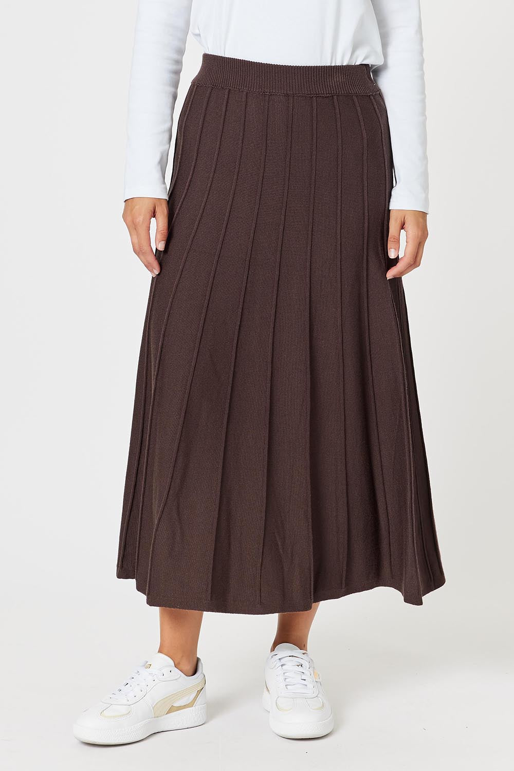 A model wearing the Kate Knit Long Skirt in colour Chocolate, from the front, cropped image