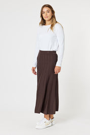 A model wearing the Kate Knit Long Skirt in colour Chocolate, from the front, showing the whole outfit