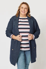 A model wearing the Violet Knit Cardigan in colour Navy (Blue), from the front, cropped image