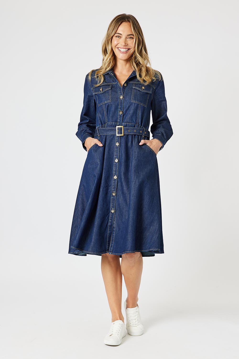 A model wearing the Capetown Denim Dress in colour Denim (Blue), from the front, showing the whole outfit