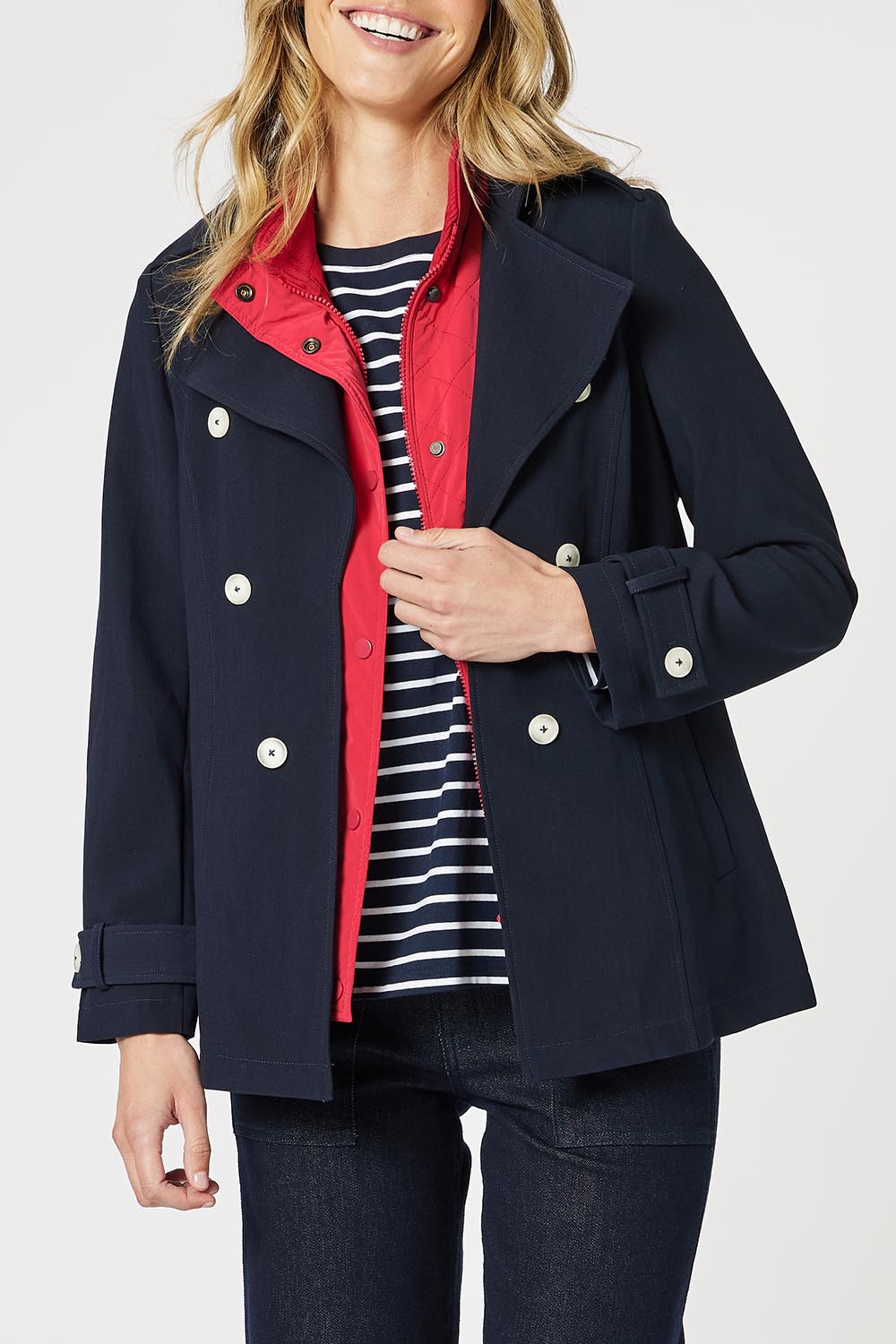 A model wearing the Chelsea Jacket in colour Navy (Blue), from the front, cropped image
