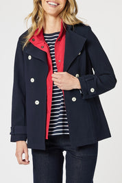 A model wearing the Chelsea Jacket in colour Navy (Blue), from the front, cropped image