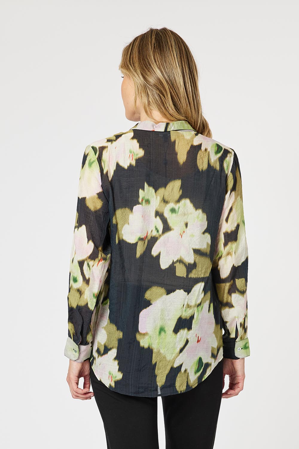 A model wearing the Maggie Shirt in colour Black (Black), from the back