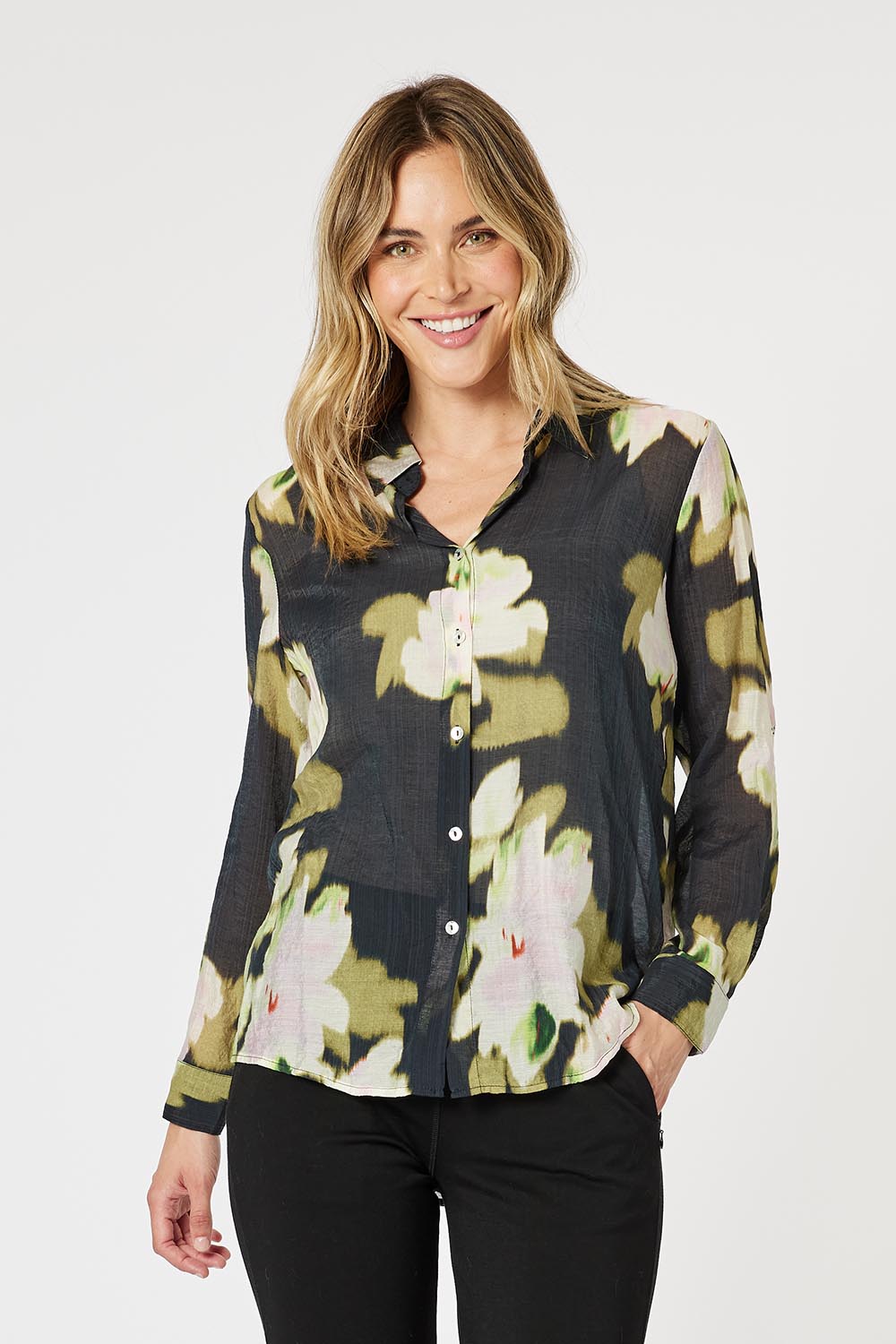 A model wearing the Maggie Shirt in colour Black (Black), from the front, cropped image