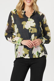A model wearing the Maggie Shirt in colour Black (Black), from the front, cropped image
