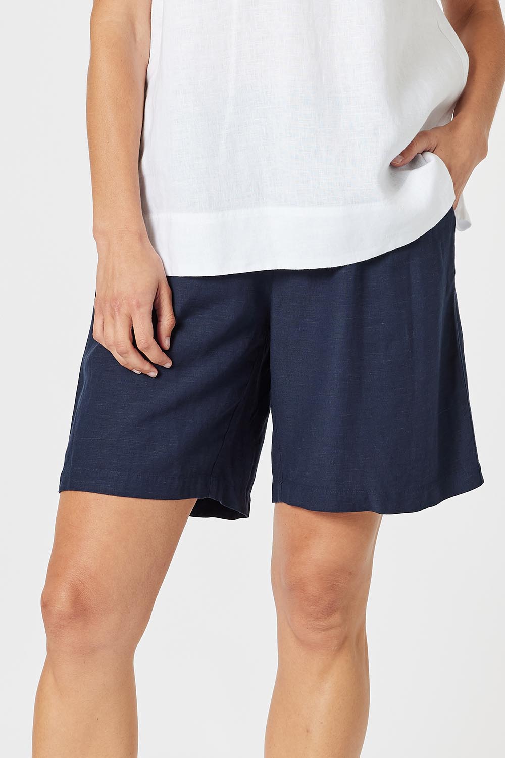 A model wearing the Lino Linen Blend Shorts in colour Navy (Blue), from the front, cropped image