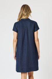 A model wearing the Delta Lino Linen Blend Dress in colour Navy (Blue), from the back