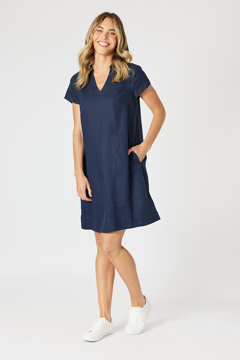 A model wearing the Delta Lino Linen Blend Dress in colour Navy (Blue), from the front, showing the whole outfit