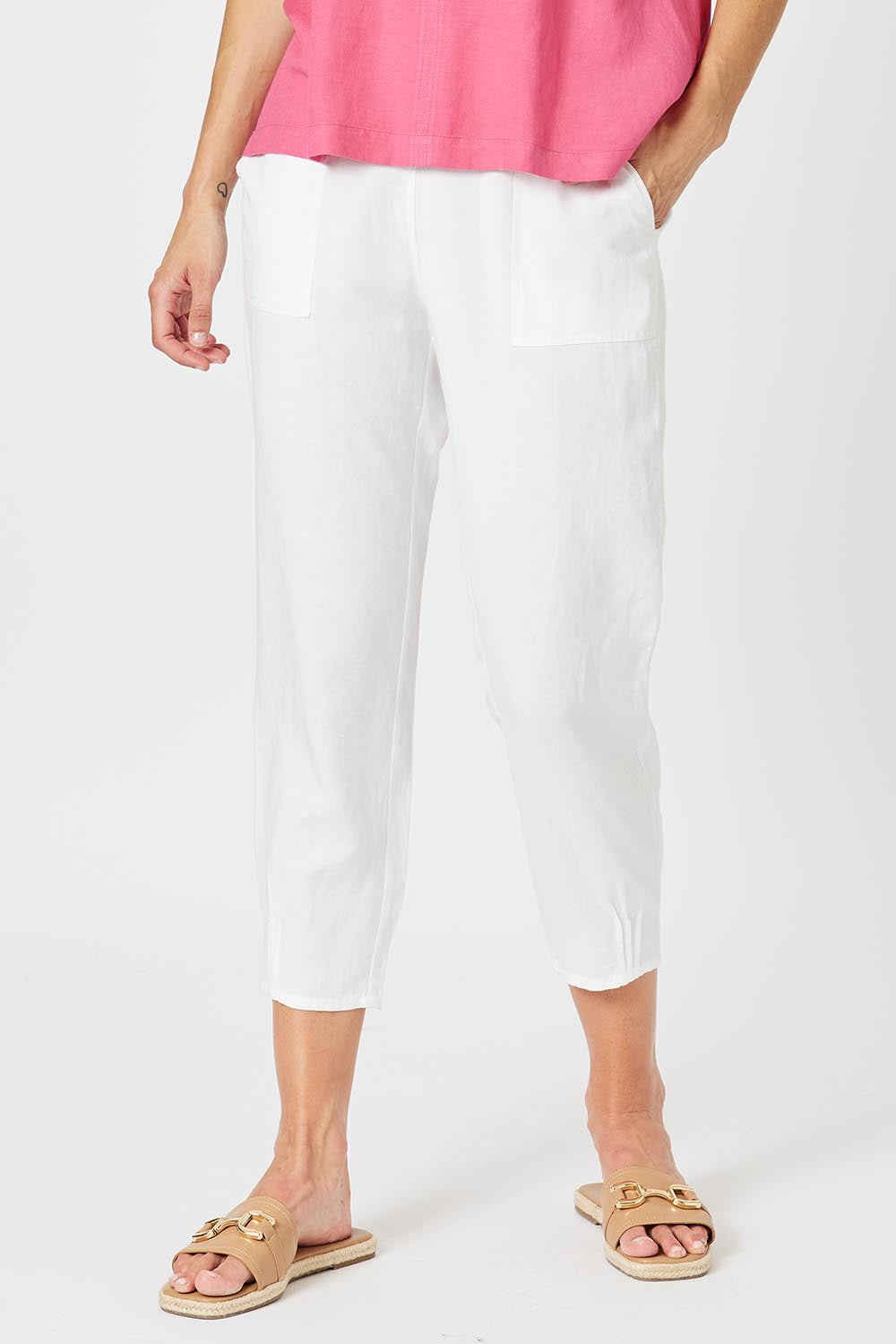 A model wearing the Lino Linen Blend Tapered Pant in colour White (White), from the front, cropped image