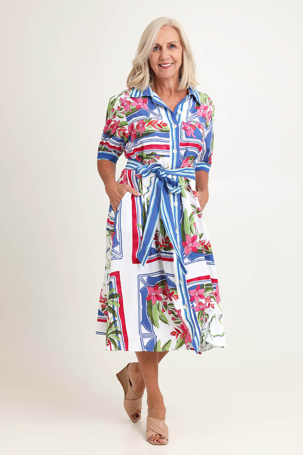 Model Sandy wearing size 10 of the Monaco Linen Blend Dress in colour Sardinia, from the front, showing the whole outfit