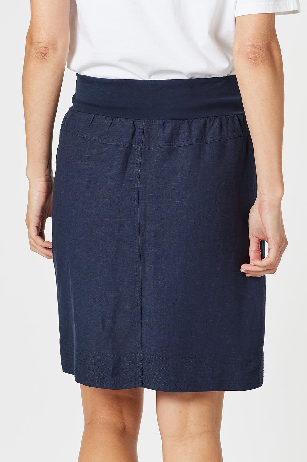 A model wearing the Lino Linen Blend Skirt in colour Navy (Blue), from the back