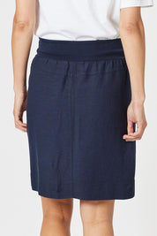 A model wearing the Lino Linen Blend Skirt in colour Navy (Blue), from the back