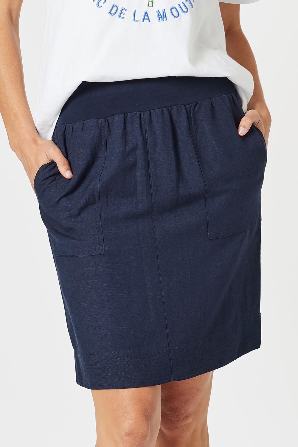 A model wearing the Lino Linen Blend Skirt in colour Navy (Blue), from the front, cropped image