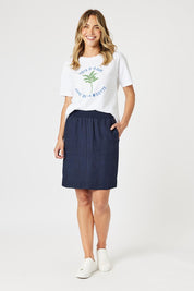 A model wearing the Lino Linen Blend Skirt in colour Navy (Blue), from the front, showing the whole outfit