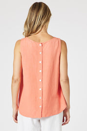 A model wearing the Lino Linen Blend Button Back Cami in colour Papaya, from the back