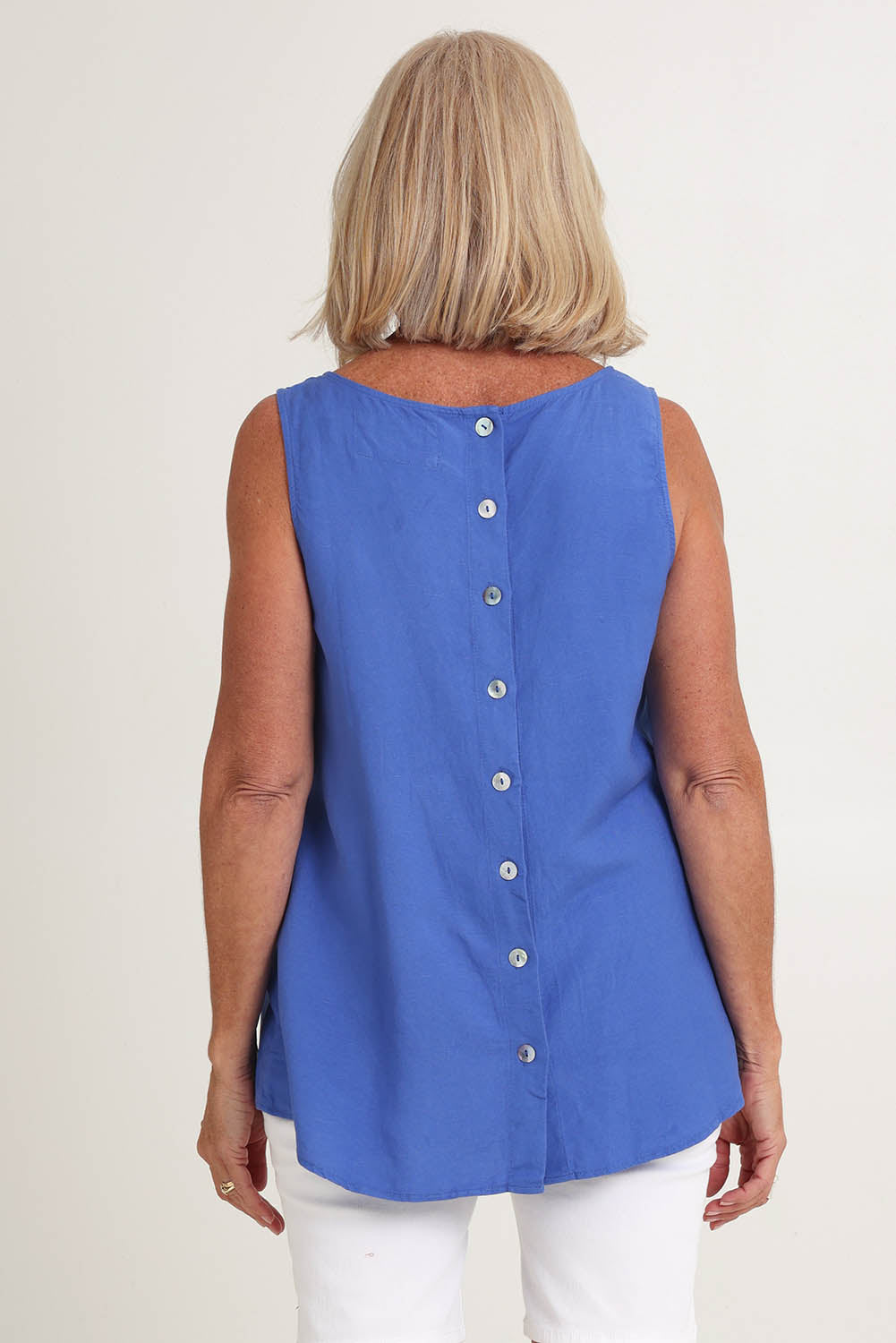 Model Sandy wearing size 10 of the Lino Linen Blend Button Back Cami in colour Sardinia (Blue), from the back