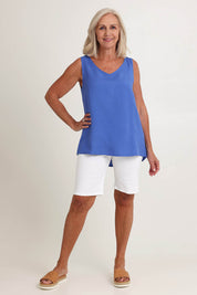 Model Sandy wearing size 10 of the Lino Linen Blend Button Back Cami in colour Sardinia (Blue), from the front, showing the whole outfit