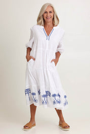 Model Sandy wearing size 10 of the Mykonos Embroidered Cotton Dress in colour White (White), from the front, showing the whole outfit