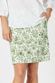 A model wearing the Alexandria Cotton Skirt in colour Basil (Green), from the front, cropped image