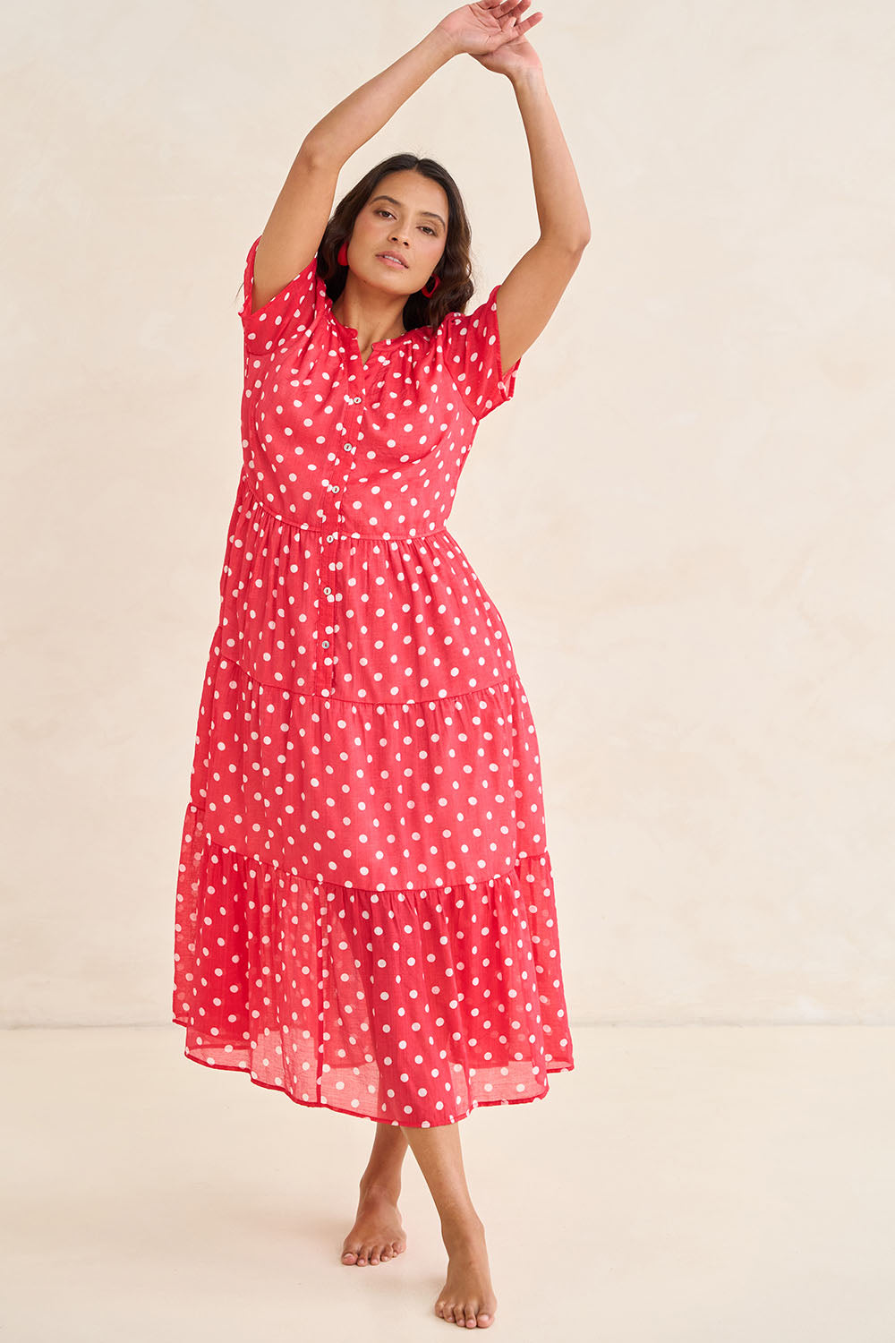 Model Tahnee wearing size 10 of the French Rose Dress in colour Red (Red), from the front, showing the whole outfit