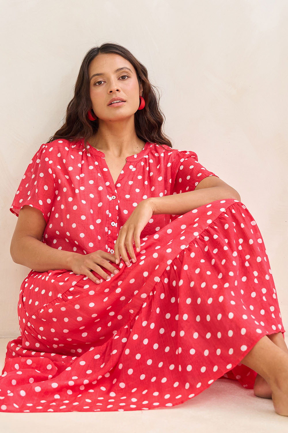 Model Tahnee wearing size 10 of the French Rose Dress in colour Red (Red), from the front, showing the whole outfit