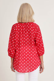 Model Sandy wearing size 10 of the French Rose Blouse in colour Red (Red), from the back