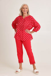 Model Sandy wearing size 10 of the French Rose Blouse in colour Red (Red), from the front, showing the whole outfit